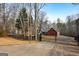 Brick house with gated entry, long driveway, and mature trees on a spacious lot at 55 Rainey Ridge Dr, Oxford, GA 30054