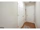 Bright hallway with hardwood floors, double closets and an additional door at 55 Rainey Ridge Dr, Oxford, GA 30054