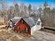 Brick house with attached garage and landscaping at 55 Rainey Ridge Dr, Oxford, GA 30054