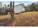 House side view, showing deck and propane tank at 55 Rainey Ridge Dr, Oxford, GA 30054