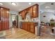 Kitchen with wood cabinets, granite countertops, and a view into the living room at 55 Rainey Ridge Dr, Oxford, GA 30054