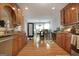 Open kitchen with wood cabinets, granite counters, and access to the dining area at 55 Rainey Ridge Dr, Oxford, GA 30054
