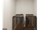 Basement laundry room with side-by-side washer and dryer at 55 Rainey Ridge Dr, Oxford, GA 30054