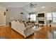 Spacious living room with hardwood floors, fireplace, and comfortable seating at 55 Rainey Ridge Dr, Oxford, GA 30054