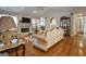 Open living space with hardwood floors, fireplace, and ample natural light at 55 Rainey Ridge Dr, Oxford, GA 30054