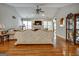 Hardwood floors, ornate sofa, and a view into the dining area at 55 Rainey Ridge Dr, Oxford, GA 30054