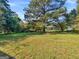 Large backyard with a spacious grassy area at 151 Andover Dr, Jonesboro, GA 30238