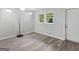 Bedroom with gray laminate floors and a window at 151 Andover Dr, Jonesboro, GA 30238