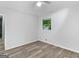 Roomy bedroom with hardwood floors and a window at 151 Andover Dr, Jonesboro, GA 30238