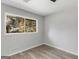 Spacious bedroom with large window and wood-look floors at 151 Andover Dr, Jonesboro, GA 30238