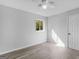 Simple bedroom with hardwood floors and a window at 151 Andover Dr, Jonesboro, GA 30238