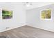 Bright bedroom with hardwood floors and two windows at 151 Andover Dr, Jonesboro, GA 30238