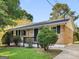 Brick ranch house with a driveway and landscaping at 151 Andover Dr, Jonesboro, GA 30238