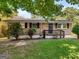 Brick ranch house with a yard, steps, and dark door at 151 Andover Dr, Jonesboro, GA 30238