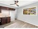 Kitchen with dark cabinets and laminate floors at 151 Andover Dr, Jonesboro, GA 30238