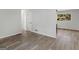 Open living space with gray floors and hallway access at 151 Andover Dr, Jonesboro, GA 30238