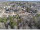 A cozy neighborhood offering a mix of homes, scenic backdrop of lush trees and rolling hills in the background at 2671 Eastmont Trl, Snellville, GA 30039