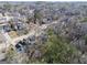 Aerial view of a neighborhood nestled amongst mature trees and lush greenery at 2671 Eastmont Trl, Snellville, GA 30039
