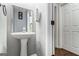 Small powder room with pedestal sink at 2671 Eastmont Trl, Snellville, GA 30039