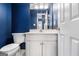 Small bathroom with white vanity and blue walls at 2671 Eastmont Trl, Snellville, GA 30039