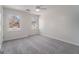 Bright bedroom with carpet, ceiling fan and window at 2671 Eastmont Trl, Snellville, GA 30039