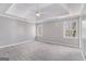Spacious bedroom with tray ceiling, new carpet, and ample natural light at 2671 Eastmont Trl, Snellville, GA 30039