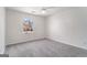 Simple bedroom with carpet, ceiling fan and window at 2671 Eastmont Trl, Snellville, GA 30039