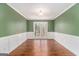 Bright dining room with wood floors and wainscoting at 2671 Eastmont Trl, Snellville, GA 30039