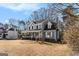 Two-story house with gray siding, white trim, and a yard at 2671 Eastmont Trl, Snellville, GA 30039