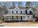Two-story house with gray siding, white trim, and a covered porch at 2671 Eastmont Trl, Snellville, GA 30039