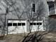 Two-car garage with white doors and gray siding at 2671 Eastmont Trl, Snellville, GA 30039