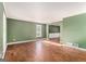 Spacious living room with hardwood floors and green walls at 2671 Eastmont Trl, Snellville, GA 30039