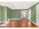 Living room with hardwood floors and green walls at 2671 Eastmont Trl, Snellville, GA 30039