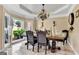 Formal dining room, featuring a large table and chandelier at 4335 Burgomeister Pl, Snellville, GA 30039