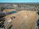 Aerial view of property with house, pond, and surrounding land at 1689 Nebo Rd, Dallas, GA 30157