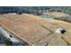 Aerial view of property showing house, pond, and outbuildings at 1689 Nebo Rd, Dallas, GA 30157