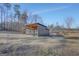 Metal and wood barn with covered stalls at 1689 Nebo Rd, Dallas, GA 30157