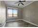 Simple bedroom with wood floors and a large window at 1689 Nebo Rd, Dallas, GA 30157