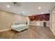 Spacious bedroom with wood floors and city skyline mural at 1689 Nebo Rd, Dallas, GA 30157