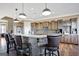 Large kitchen island with seating, granite countertops and stone facade at 1689 Nebo Rd, Dallas, GA 30157