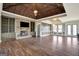 Open living space with hardwood floors, stone fireplace and built-in shelving at 1689 Nebo Rd, Dallas, GA 30157