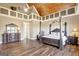 Main bedroom with hardwood floors and a large window at 1689 Nebo Rd, Dallas, GA 30157