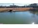 Serene pond view with a dock and surrounding landscape at 1689 Nebo Rd, Dallas, GA 30157