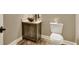 Powder room with pedestal sink and wood vanity at 1689 Nebo Rd, Dallas, GA 30157