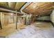 Unfinished basement with exposed utilities and concrete floor at 241 Simon Ter, Atlanta, GA 30338