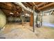 Unfinished basement with exposed utilities and concrete floor at 241 Simon Ter, Atlanta, GA 30338