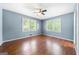 Spacious bedroom with wood flooring and dual windows at 241 Simon Ter, Atlanta, GA 30338