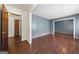 Hallway with hardwood floors and doors to other rooms at 241 Simon Ter, Atlanta, GA 30338