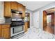 Kitchen features wood cabinets and appliances at 241 Simon Ter, Atlanta, GA 30338