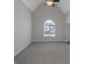 Spacious bedroom with high ceilings and a large arched window at 625 Armitage Way, Stockbridge, GA 30281